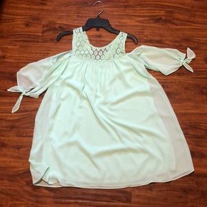 Blue lace top dress with shoulder cut outs and ties on the sleeves